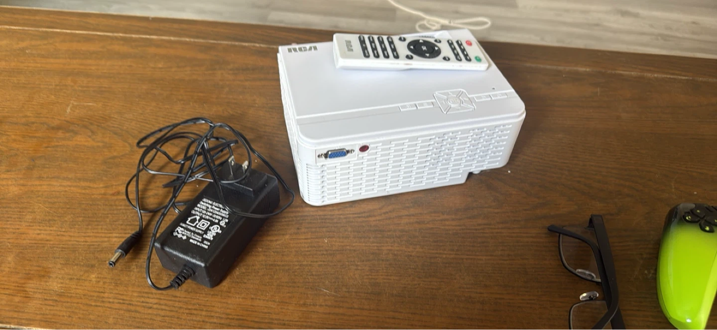 RCA Mini Projector with Remote and Power Adapter - photo 2