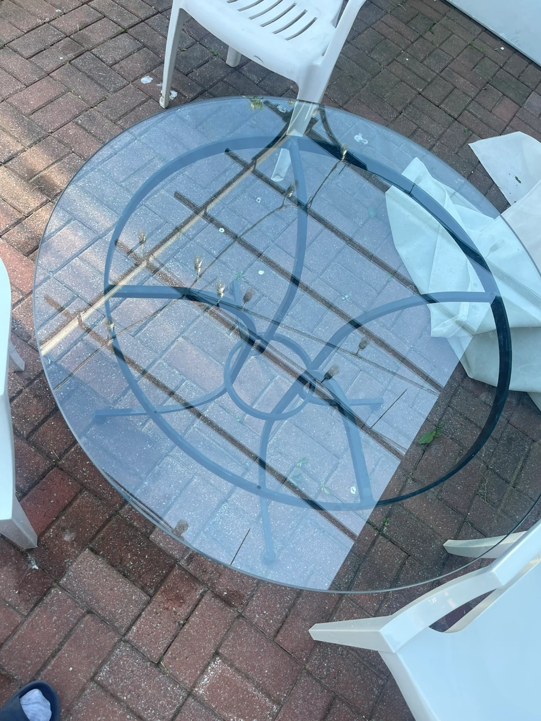 Glass top outdoor table with metal base