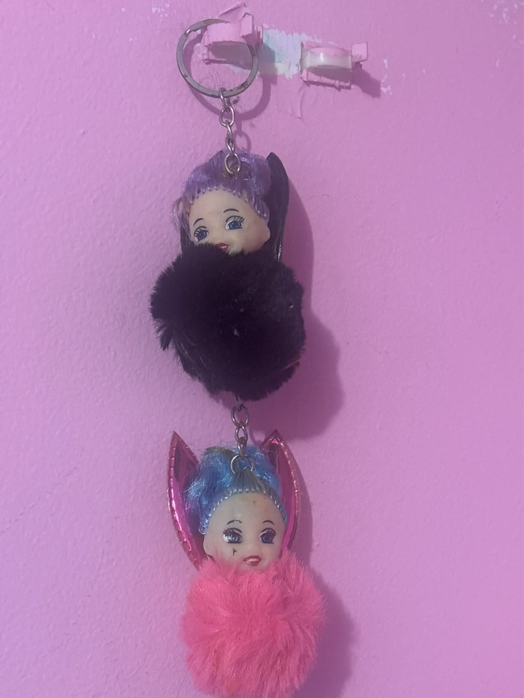Doll head keychains with pom poms