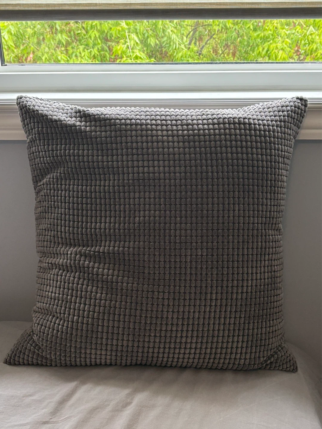 Grey textured throw pillow