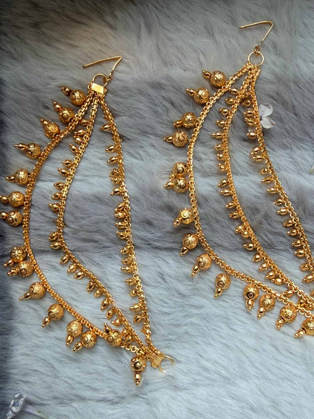 Gold-tone layered chain earrings with bead accents
