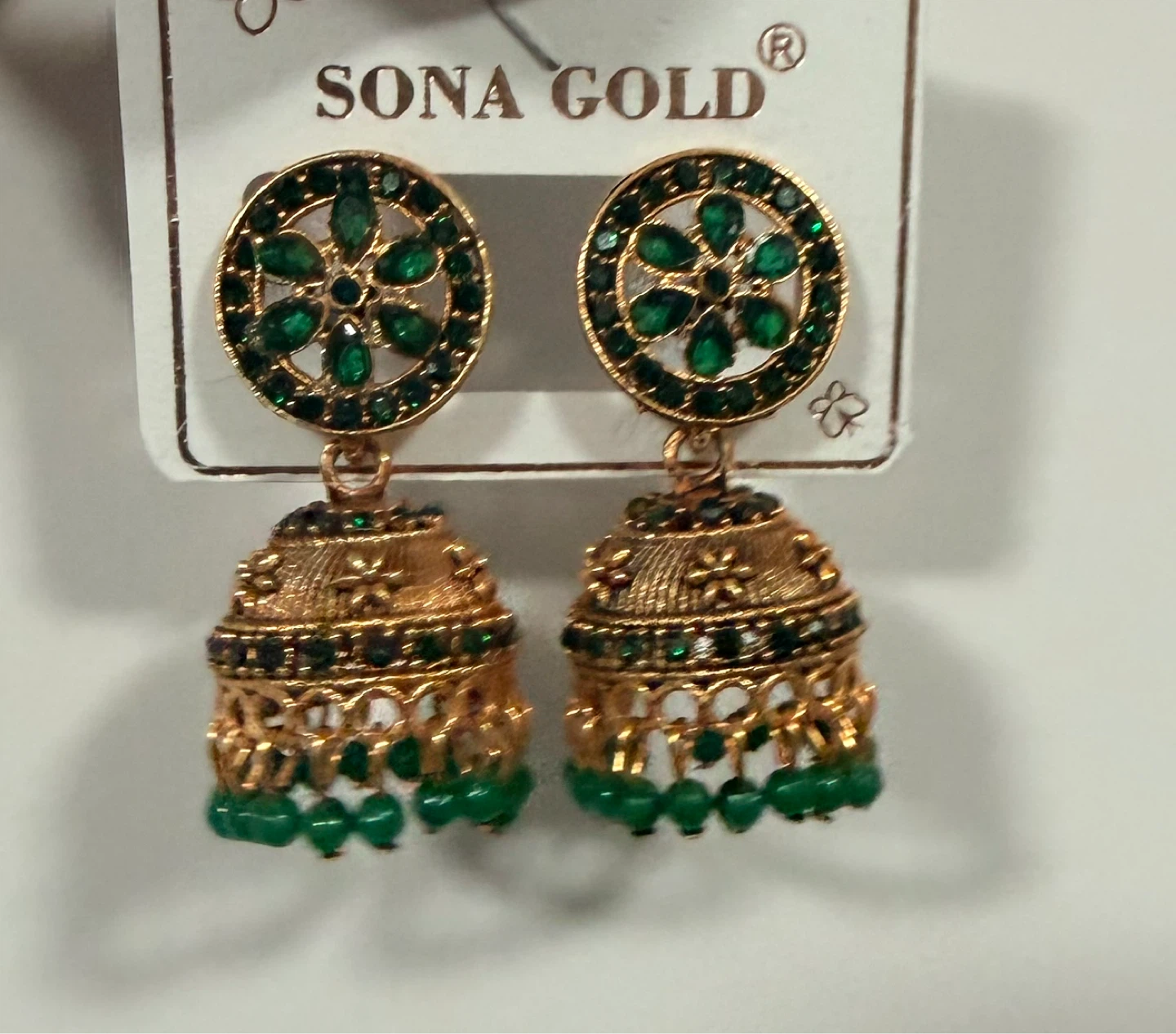 Sona Gold Jhumka Earrings with Green Stones