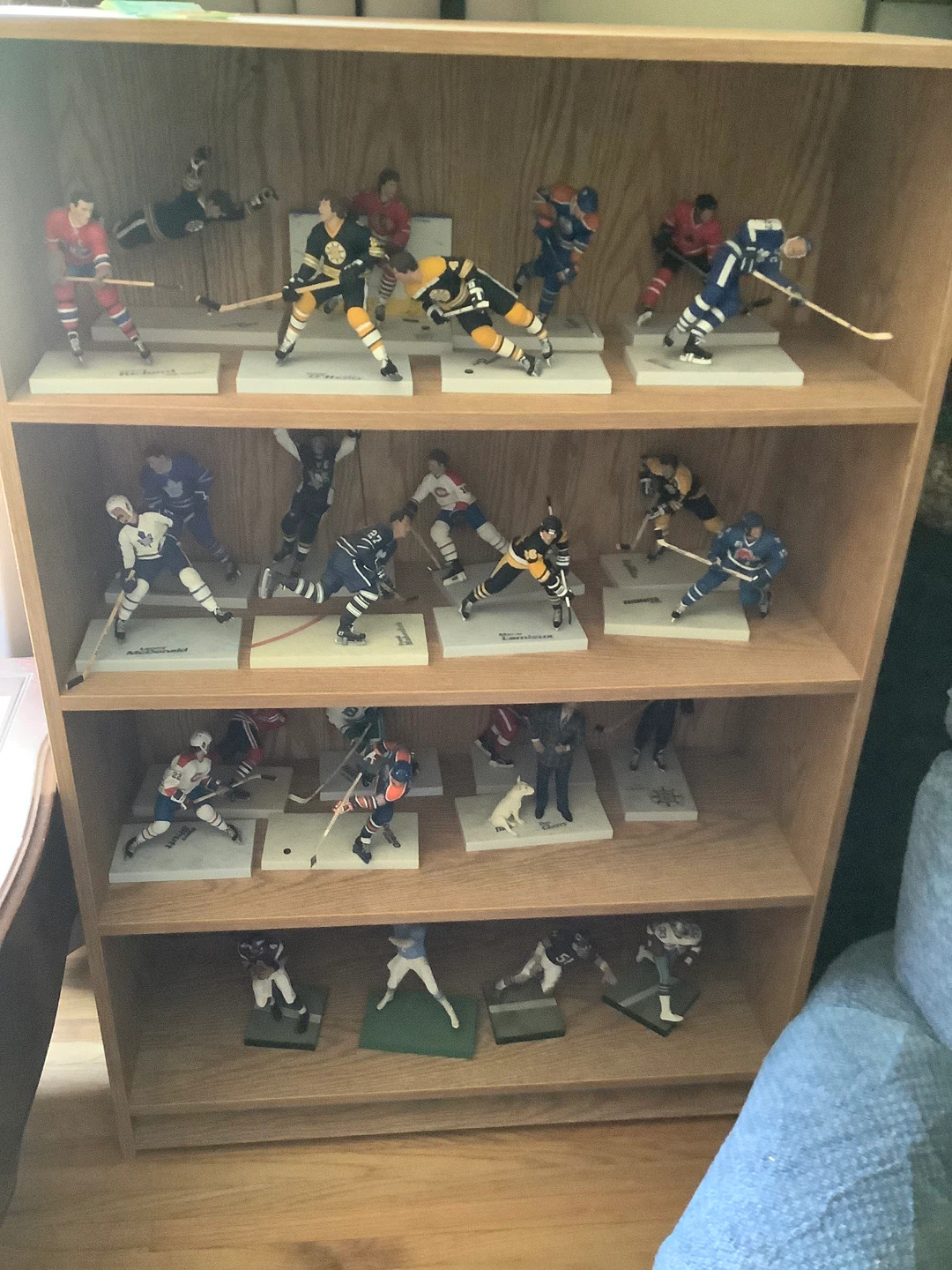 Collection of Hockey Figurines with shelf