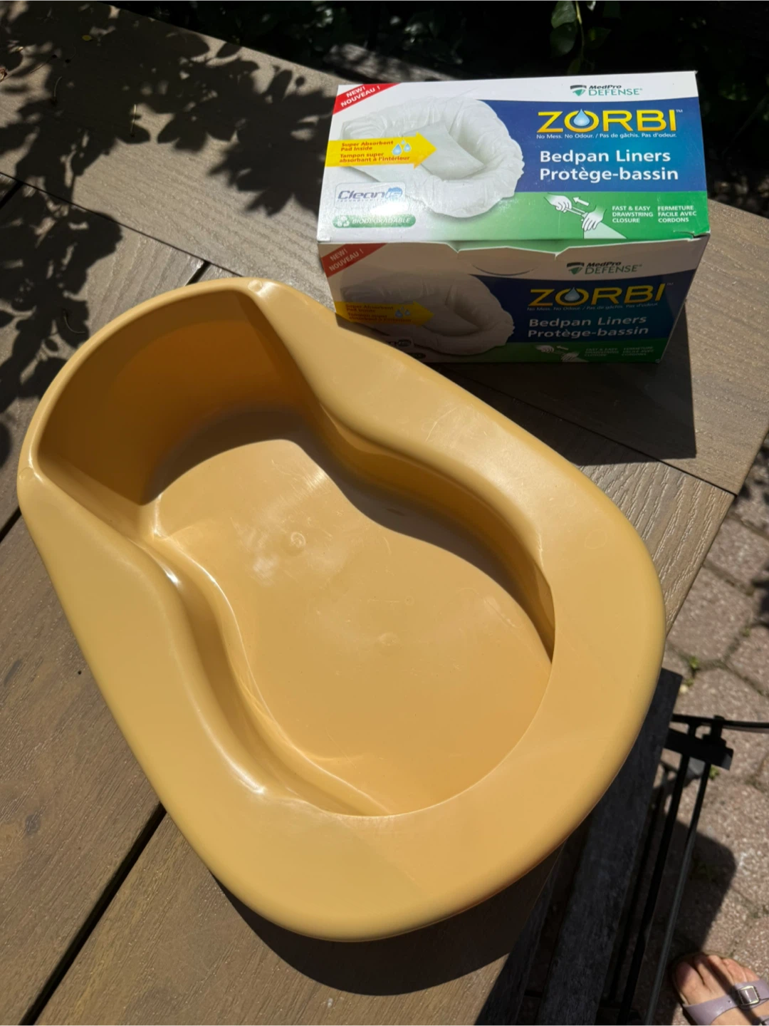 Bedpan and a box of bedpan liners