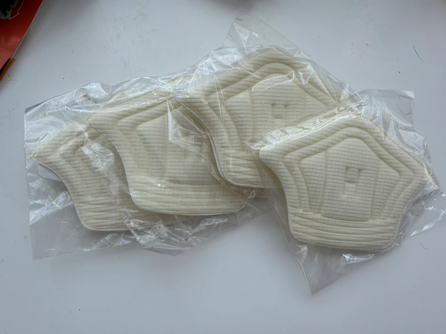 Self-adhesive foam heel liners