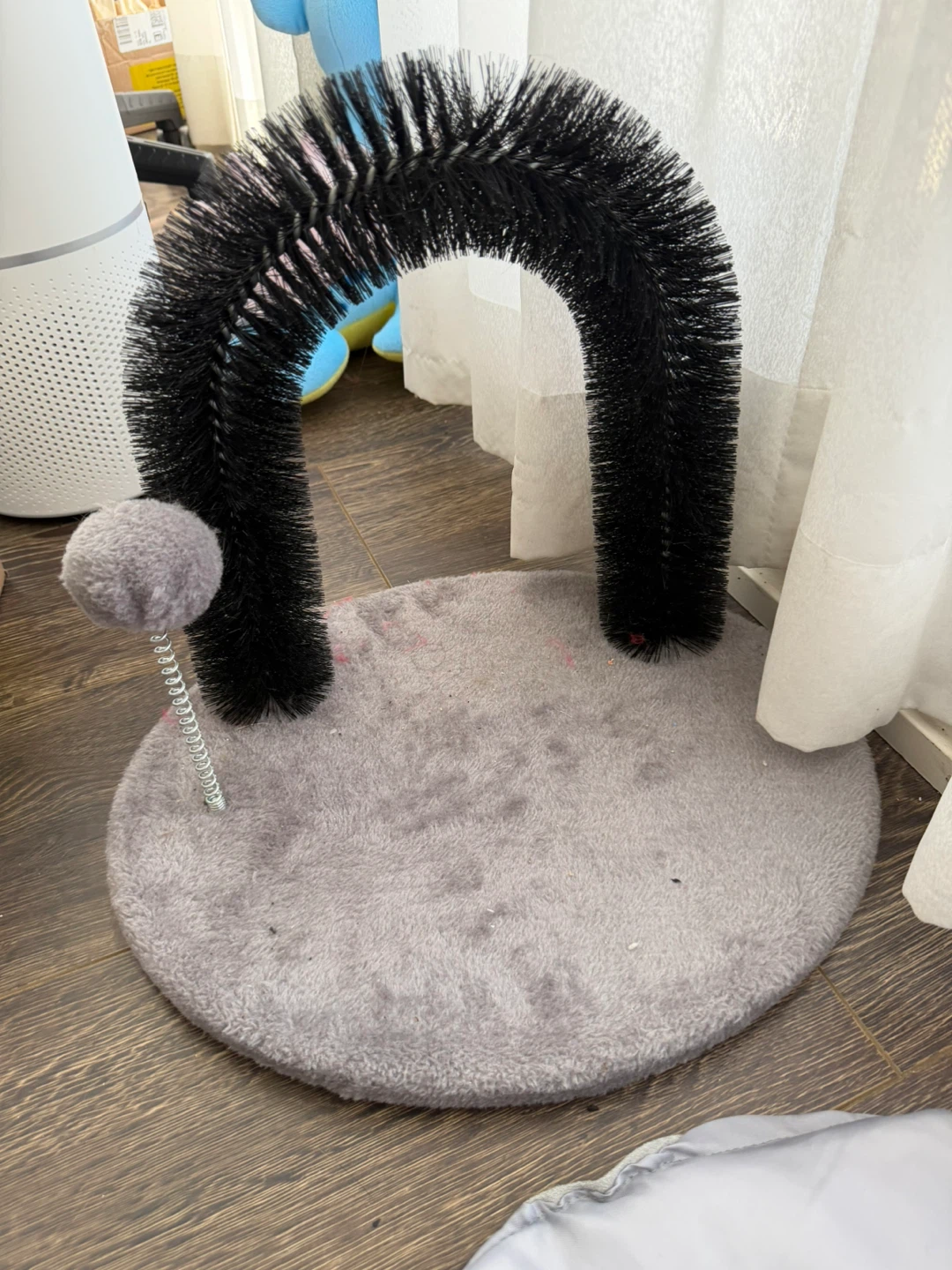 Cat self-groomer + wand toy