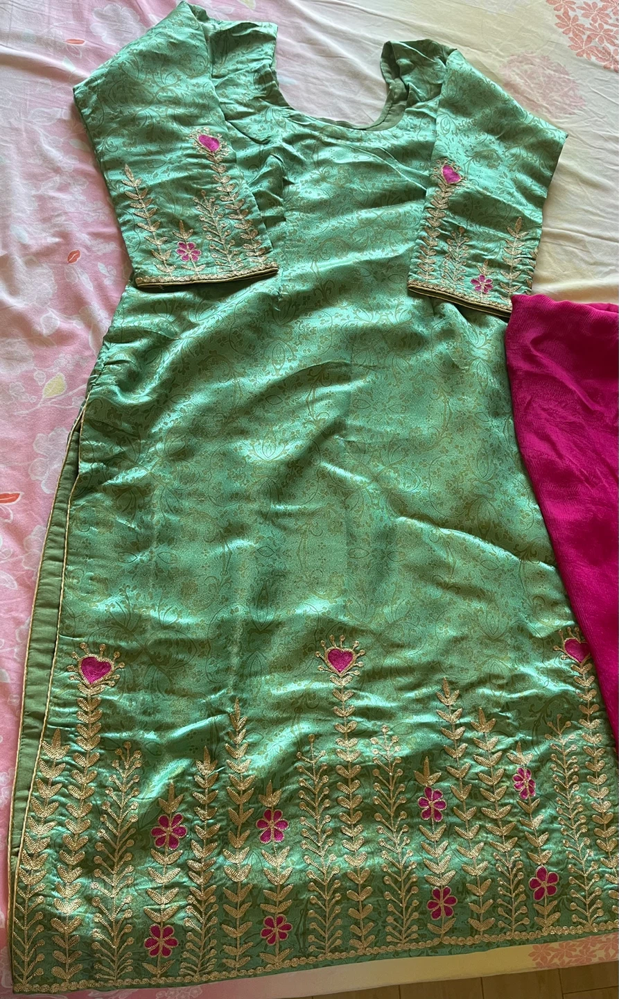 Green Kurti with Pink Salwar and dupta.
