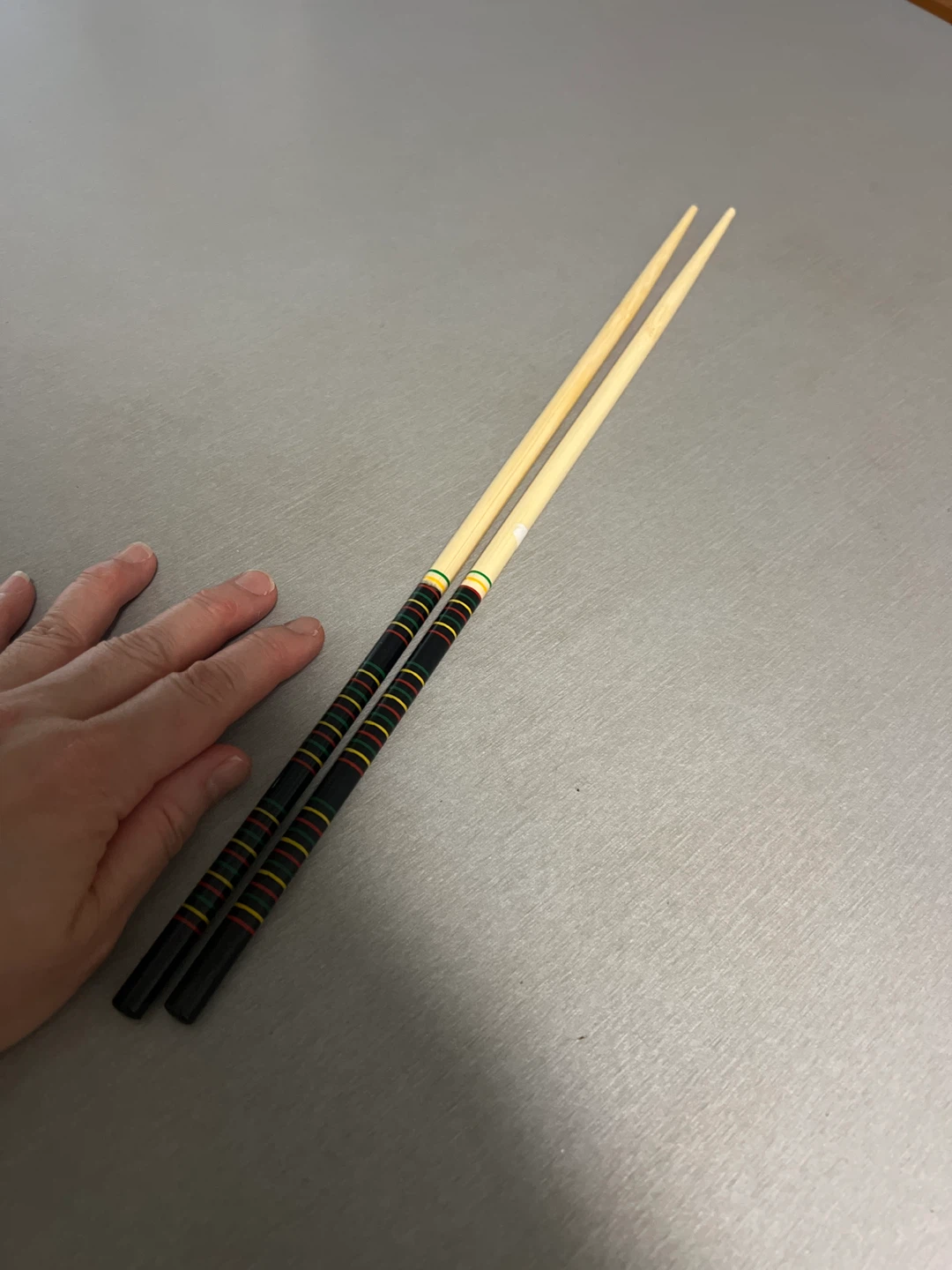 Set of two wooden chopsticks with colorful bands