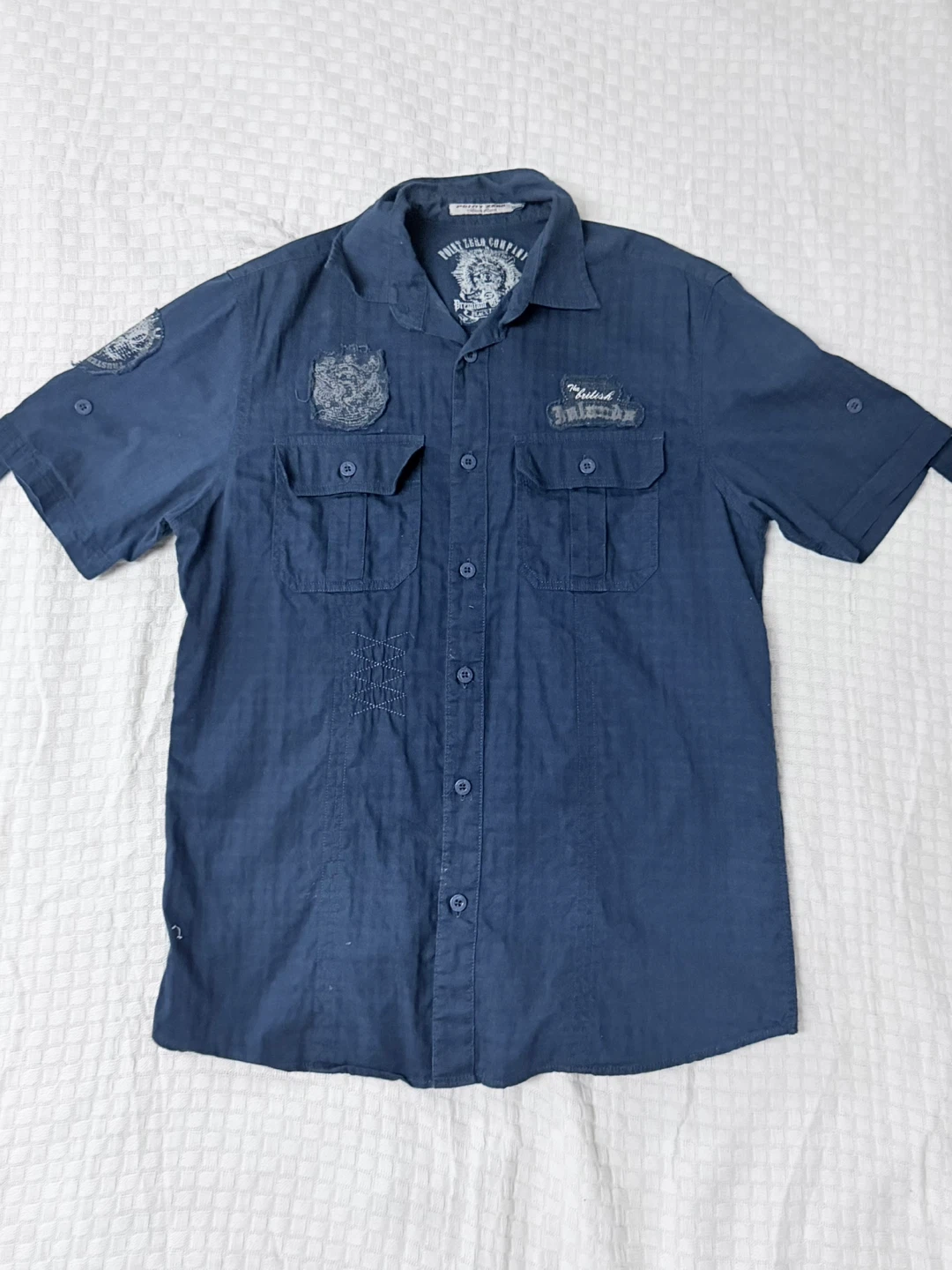 Navy blue button up shirt with embroidered details