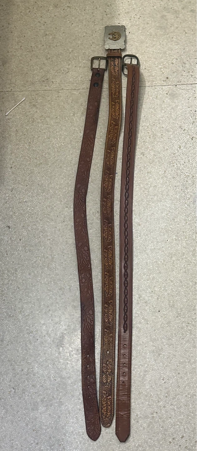 Vintage brown leather western belts individually priced.