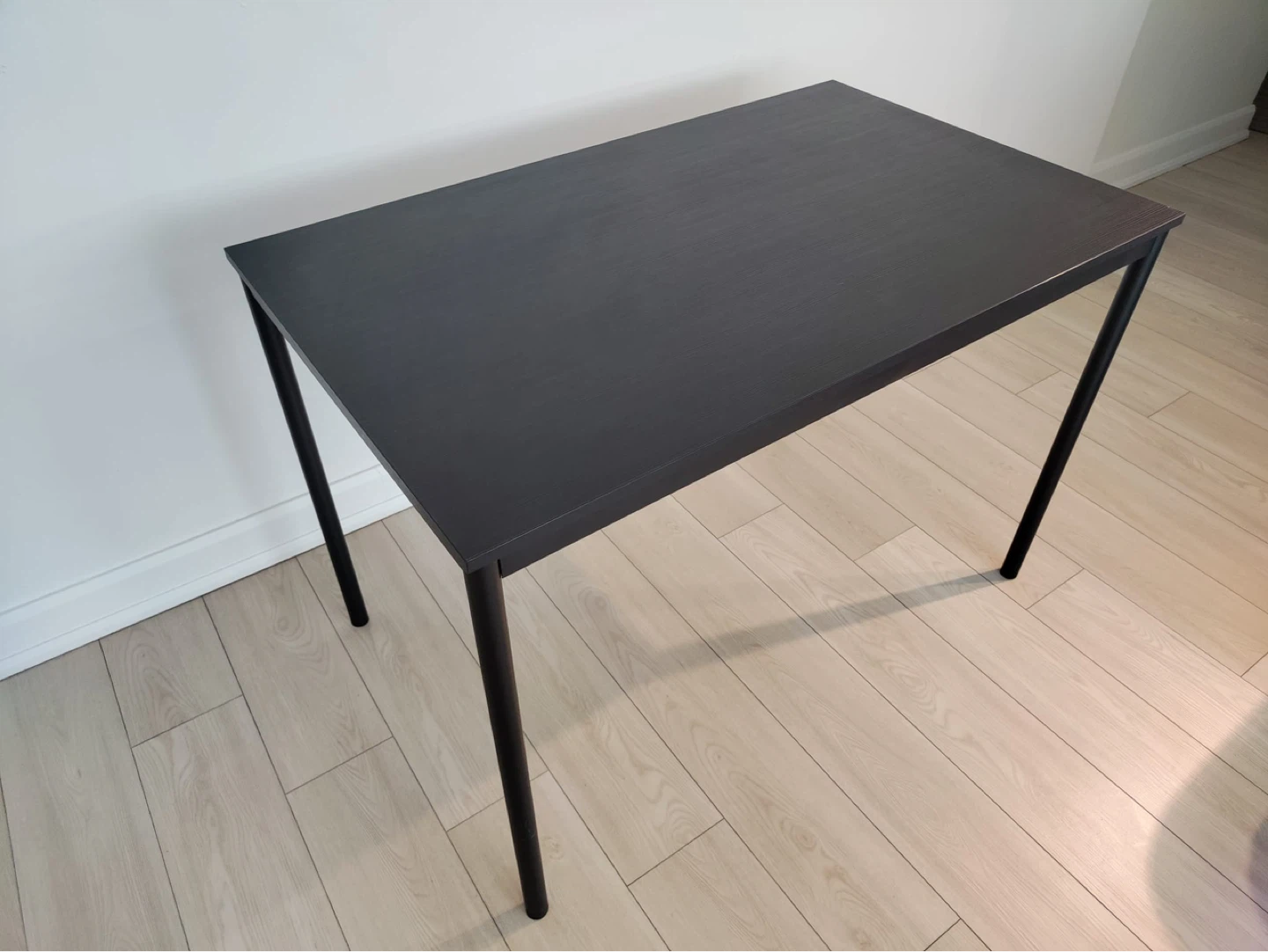 IKEA Tommaryd table: black, seats 4, one chipped corner