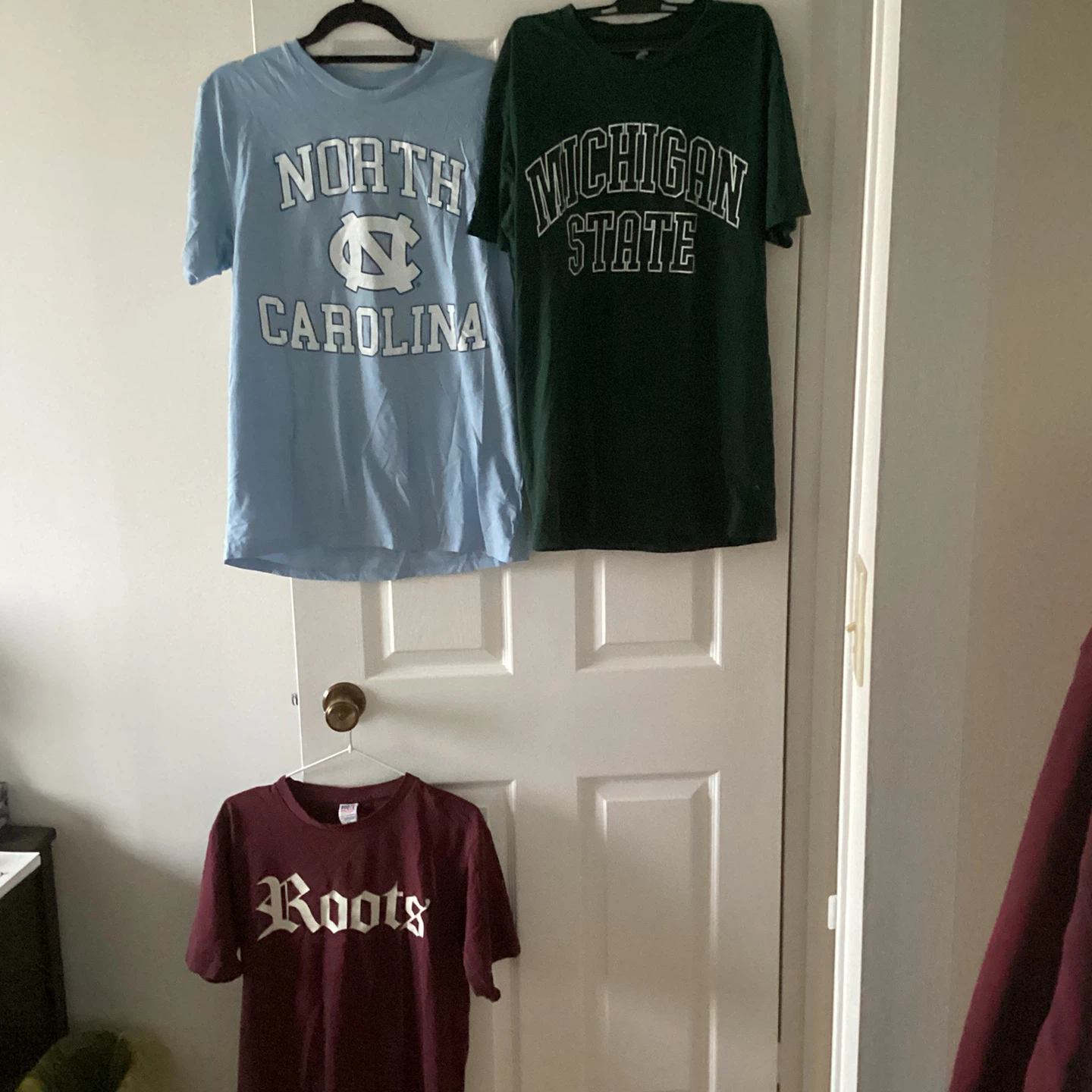 3 men’s T-Shirts (Roots, Michigan State, UNC)