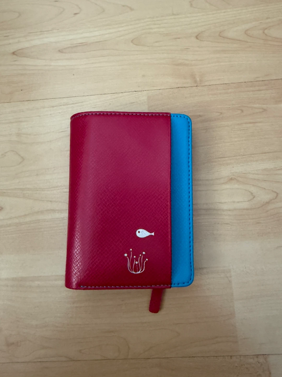 Magenta and blue wallet with fish reef design