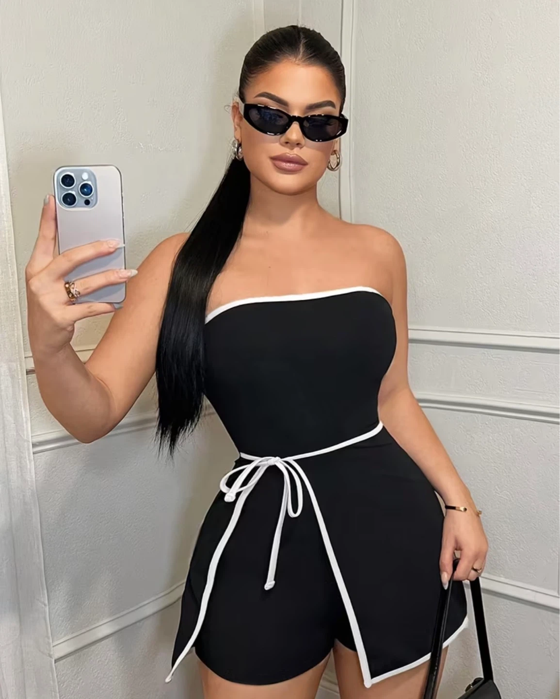 Black strapless romper with white trim. Size xsmall