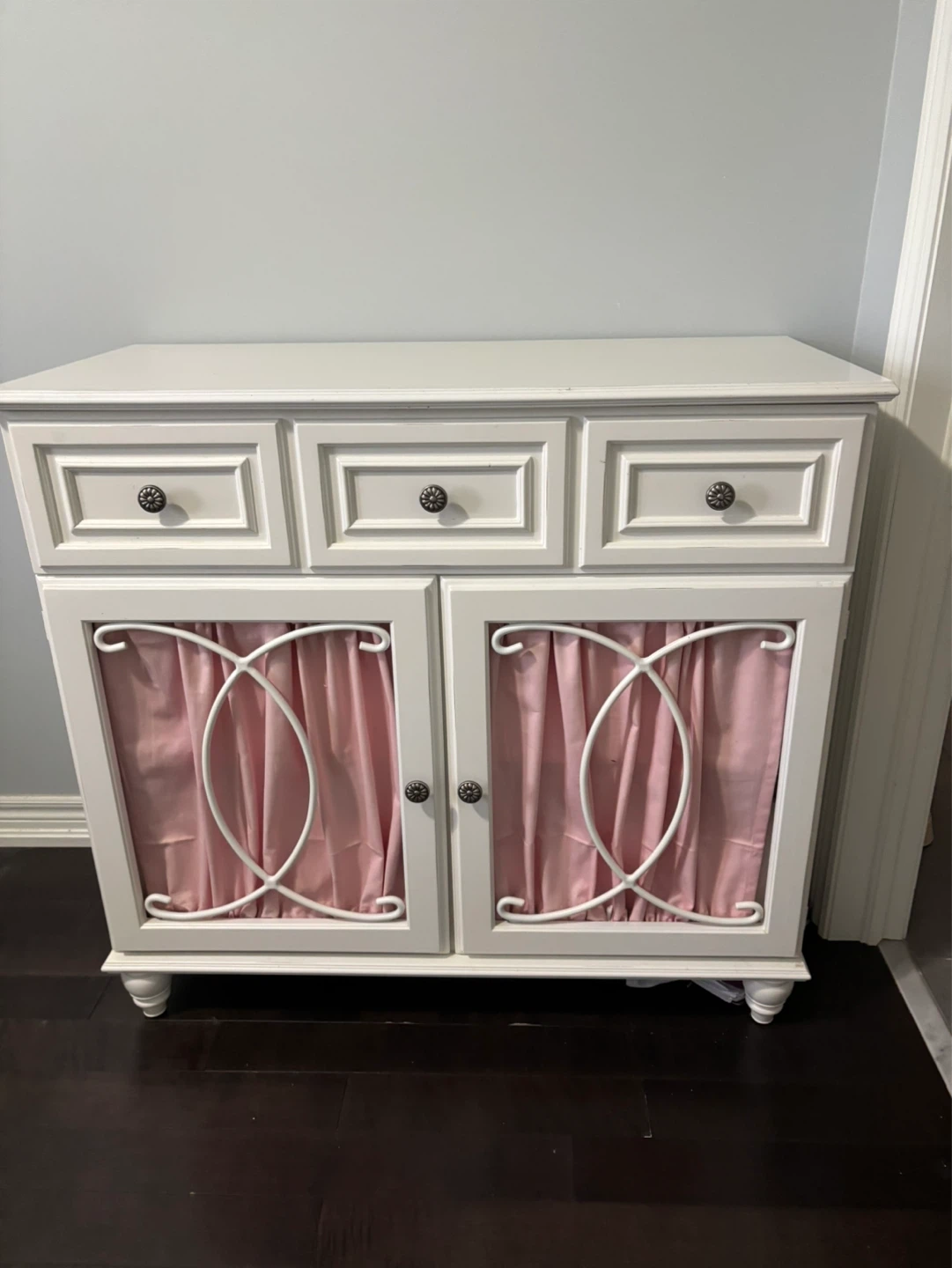 White Accent Cabinet with Pink Curtains