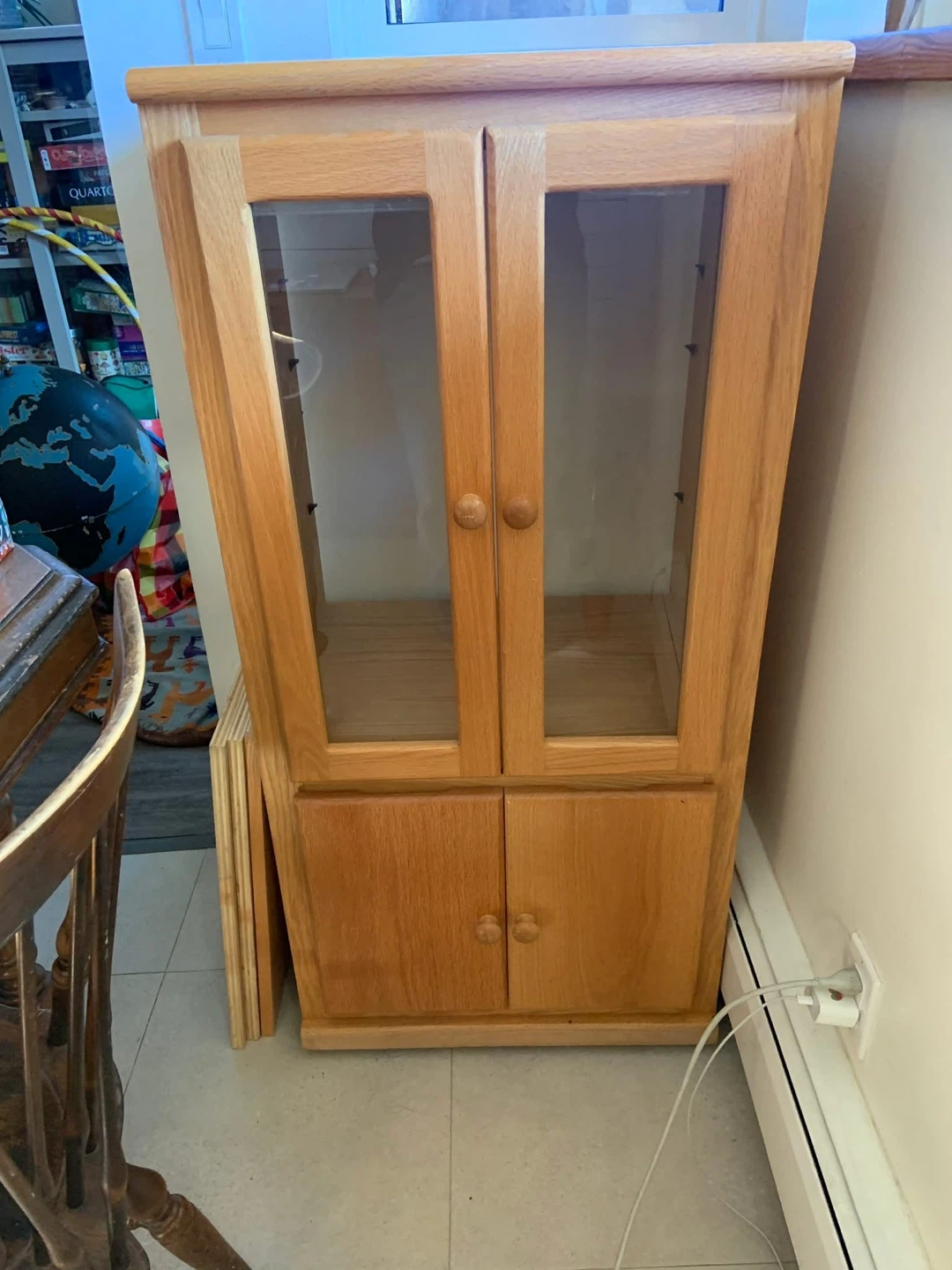 Wooden curio cabinet with glass doors