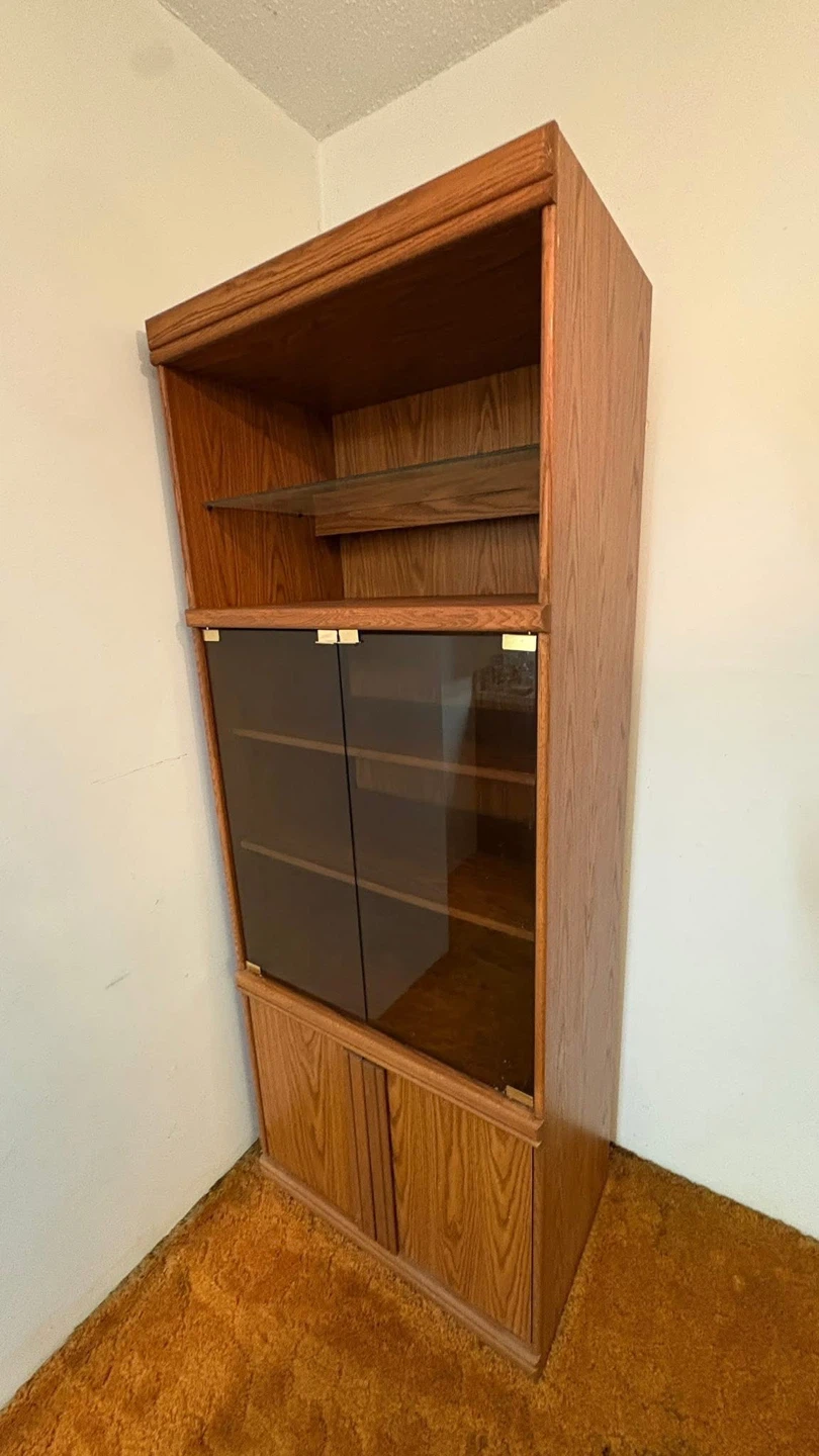 Wooden bookshelf with glass doors