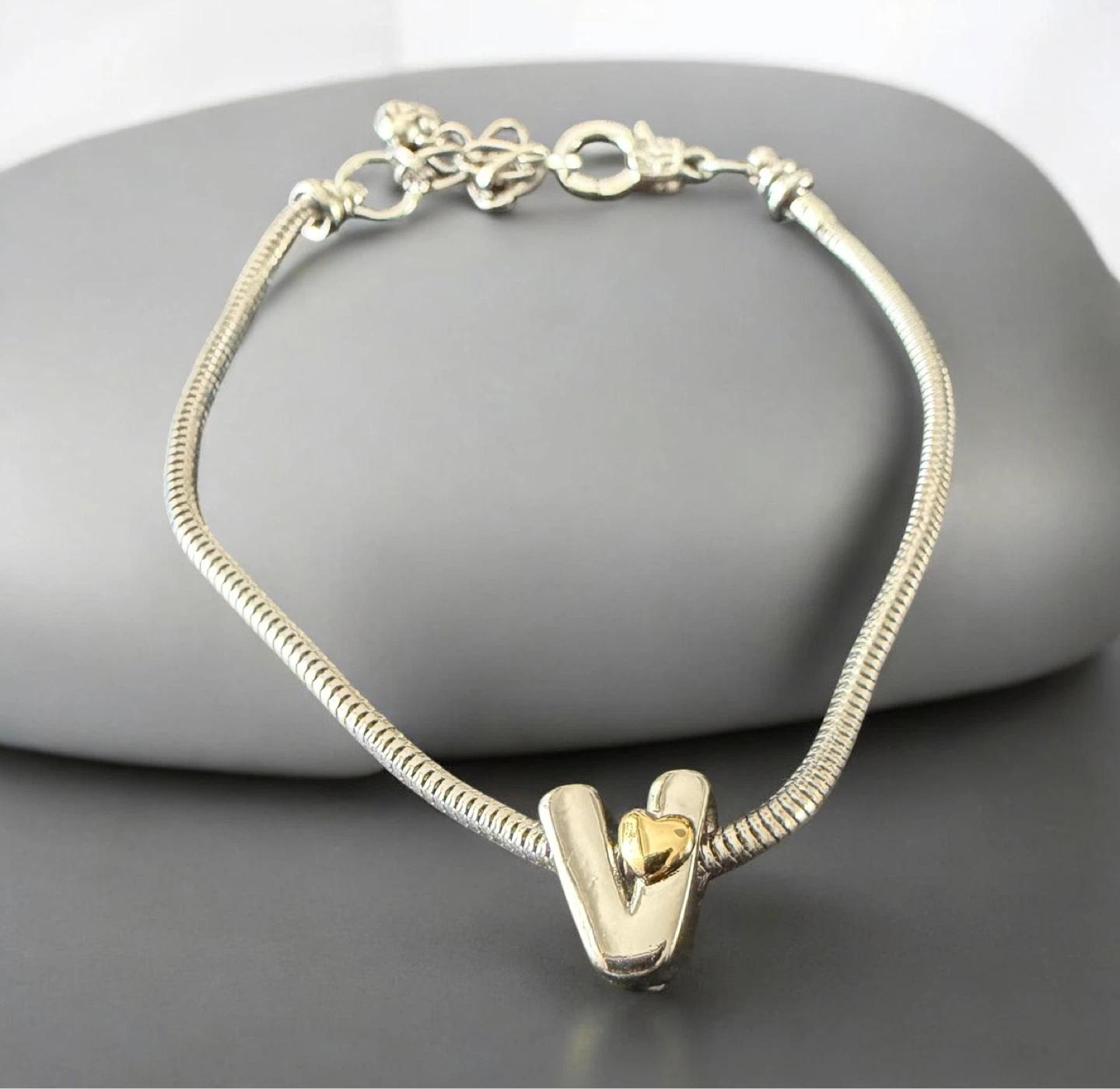 Silver and Gold Tone "V" Charm Bracelet