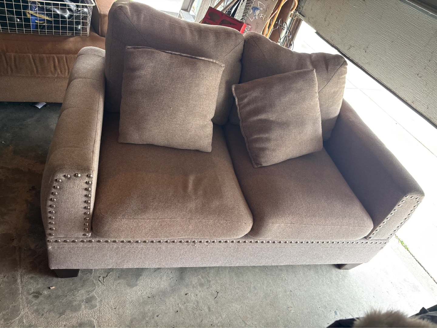 Small Loveseat. Easy garage pick up . Needs cleaning