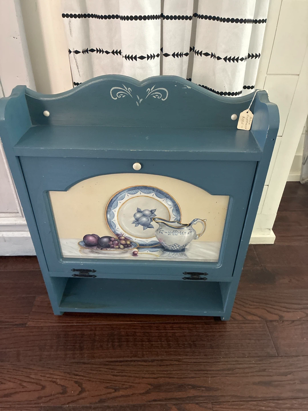 Blue Decorative Shelf with Plate and Pitcher Graphic