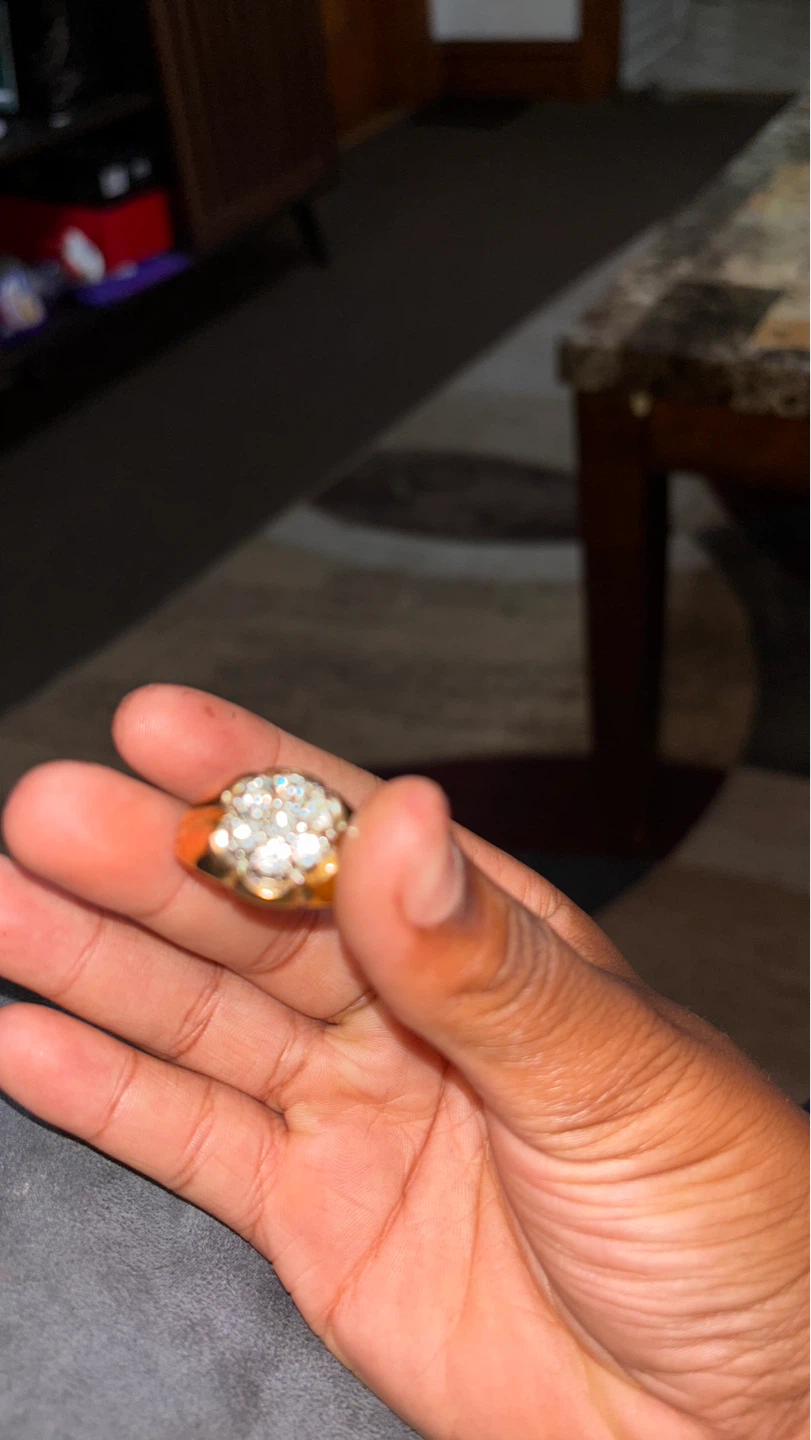 Gold tone ring with clear stones