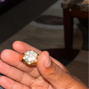 Gold tone ring with clear stones