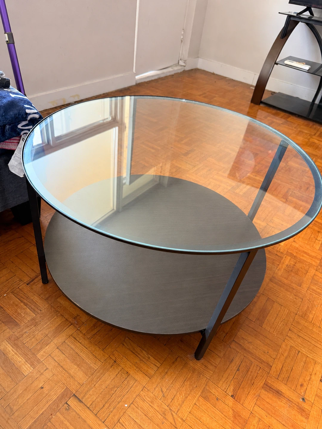Round Glass Coffee Table with Black Metal Frame