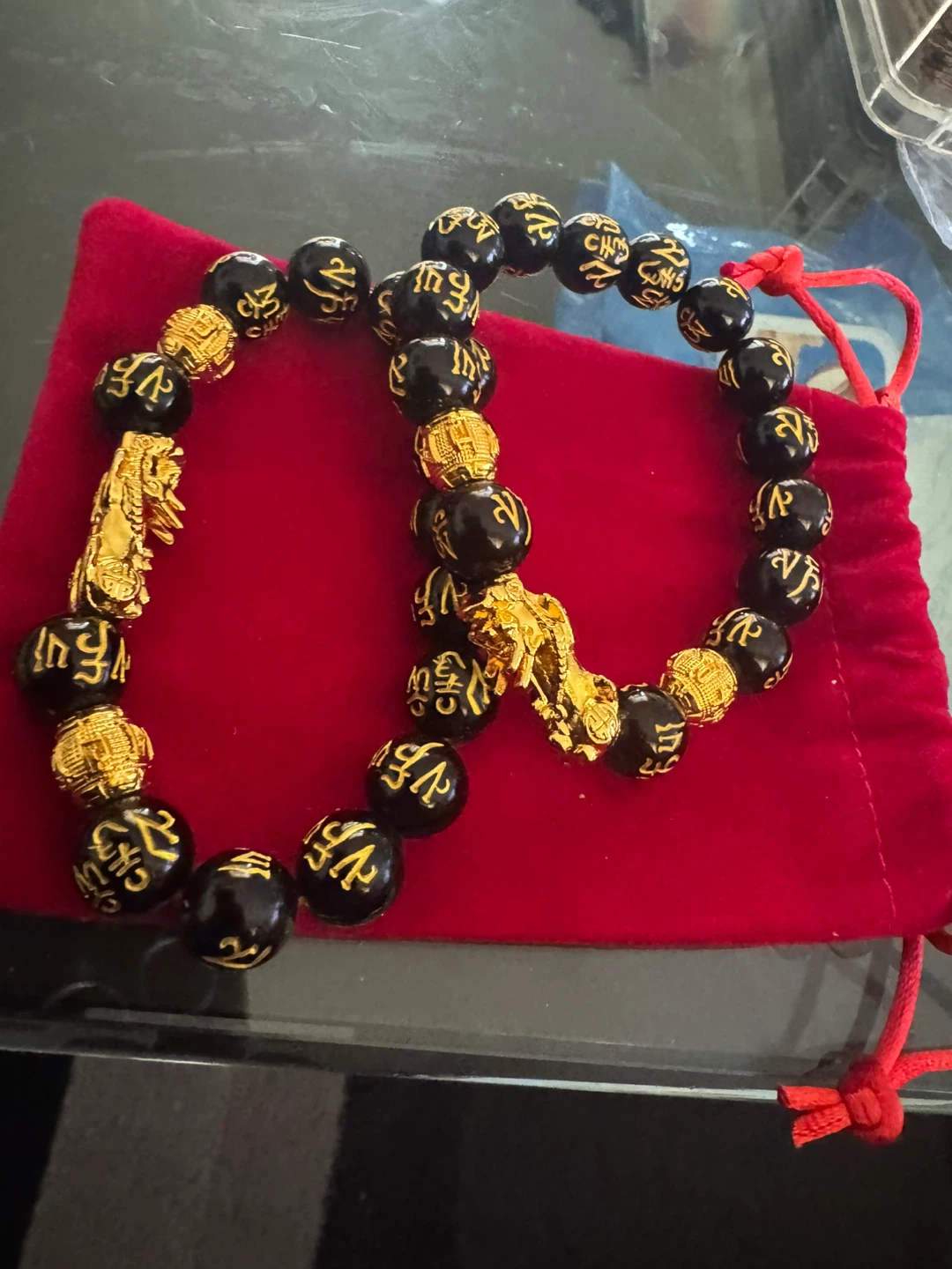 Black Beaded Bracelets with Gold Charms
