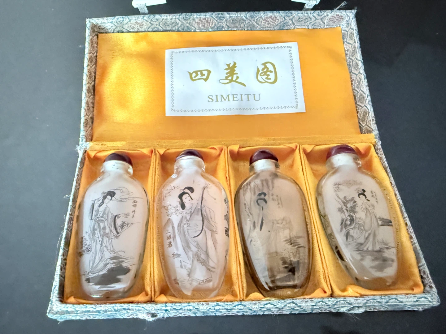 Set of 4 Glass Snuff Bottles with Scenic Designs