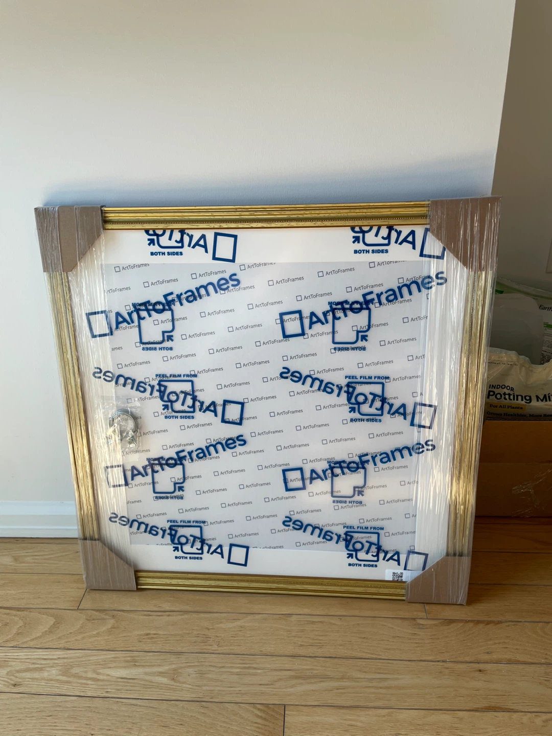 Ornate gold picture frame with mat, 26 x 26 inches