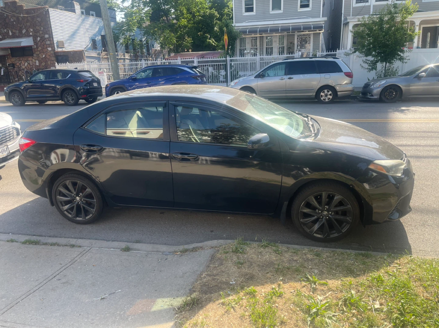 Black Toyota Corolla LE Sedan