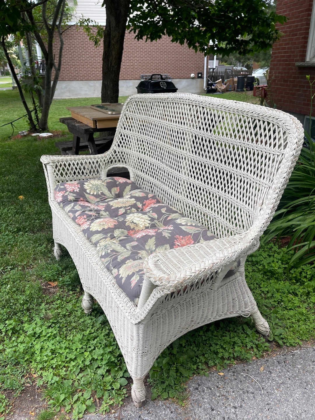 Wicker Loveseat with Floral Cushions
