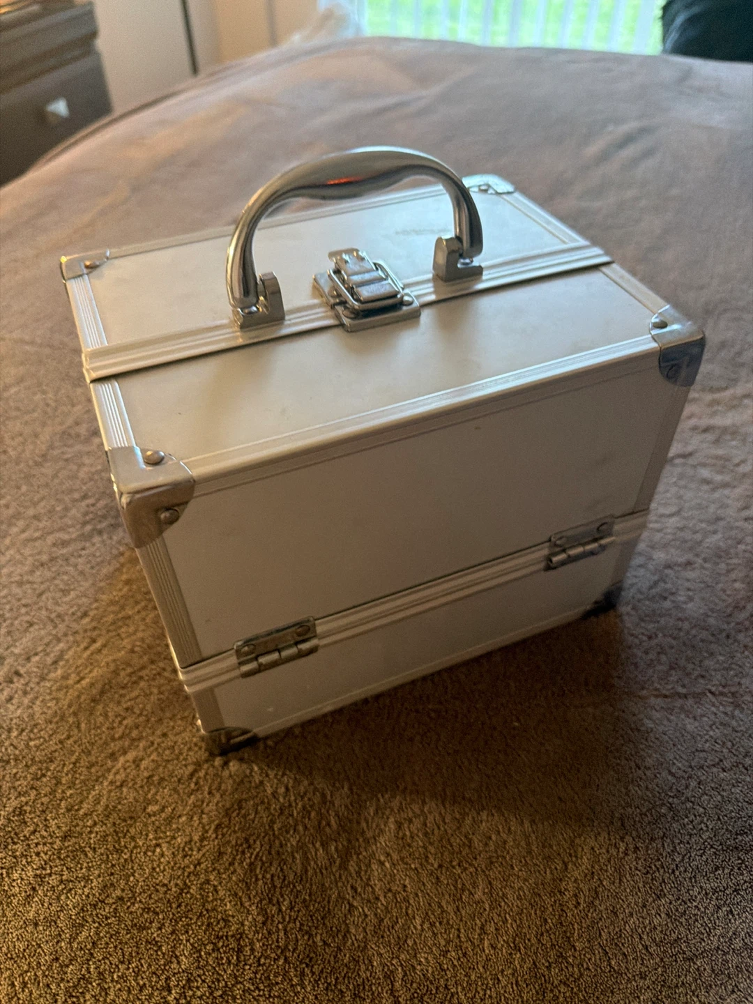 Silver train case with multiple compartments