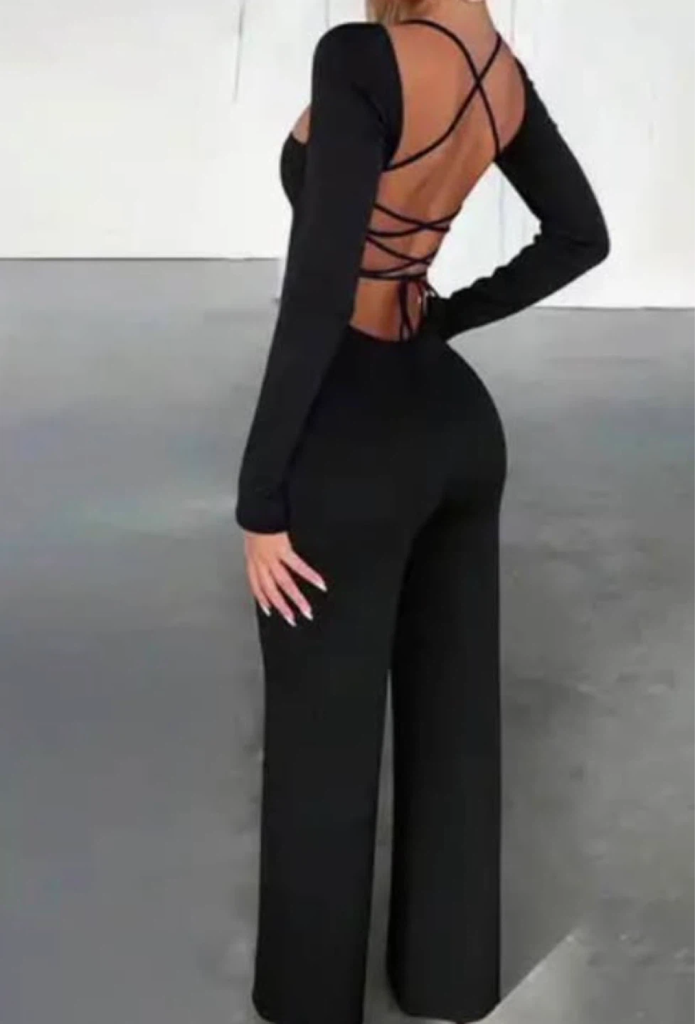 Black Long Sleeve SJumpsuit with tie up back. Size large