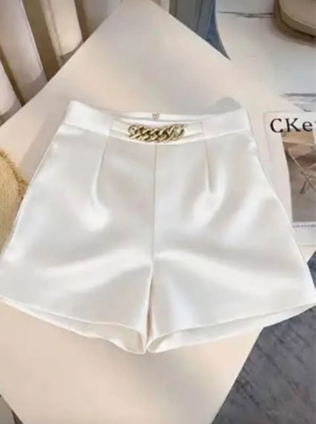 White Satin Shorts with Gold Chain Detail. Size large