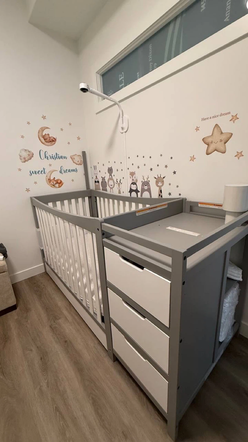 Grey Crib with Attached Changing Table and Drawers
