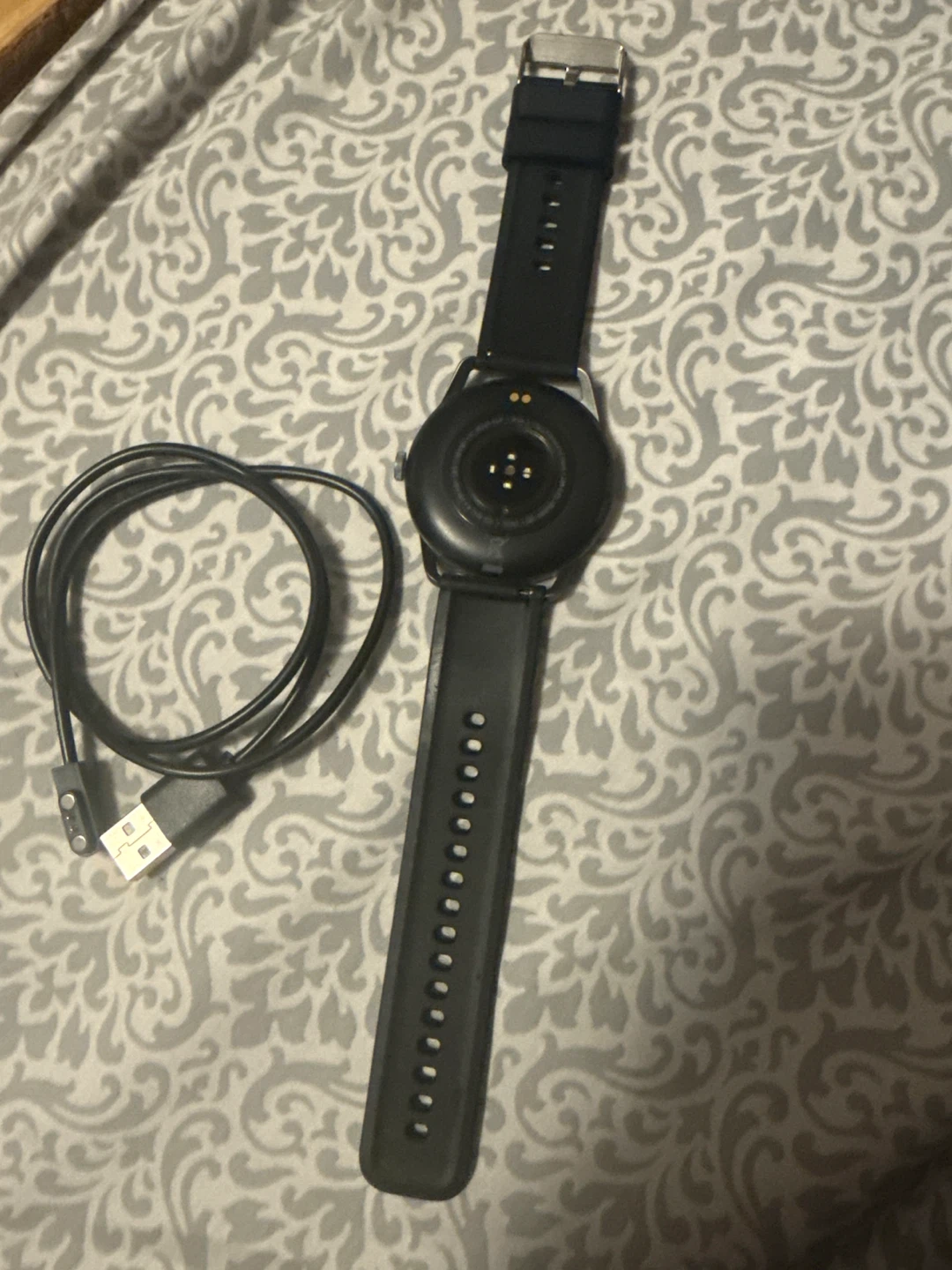 Black Smartwatch with Charging Cable