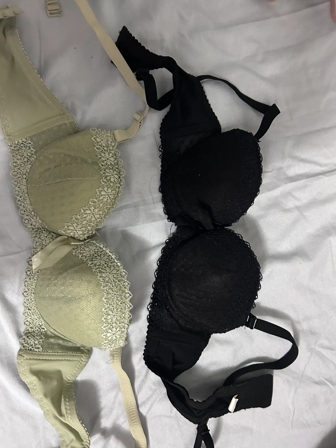 Two bras, one black, one beige, size 34/75