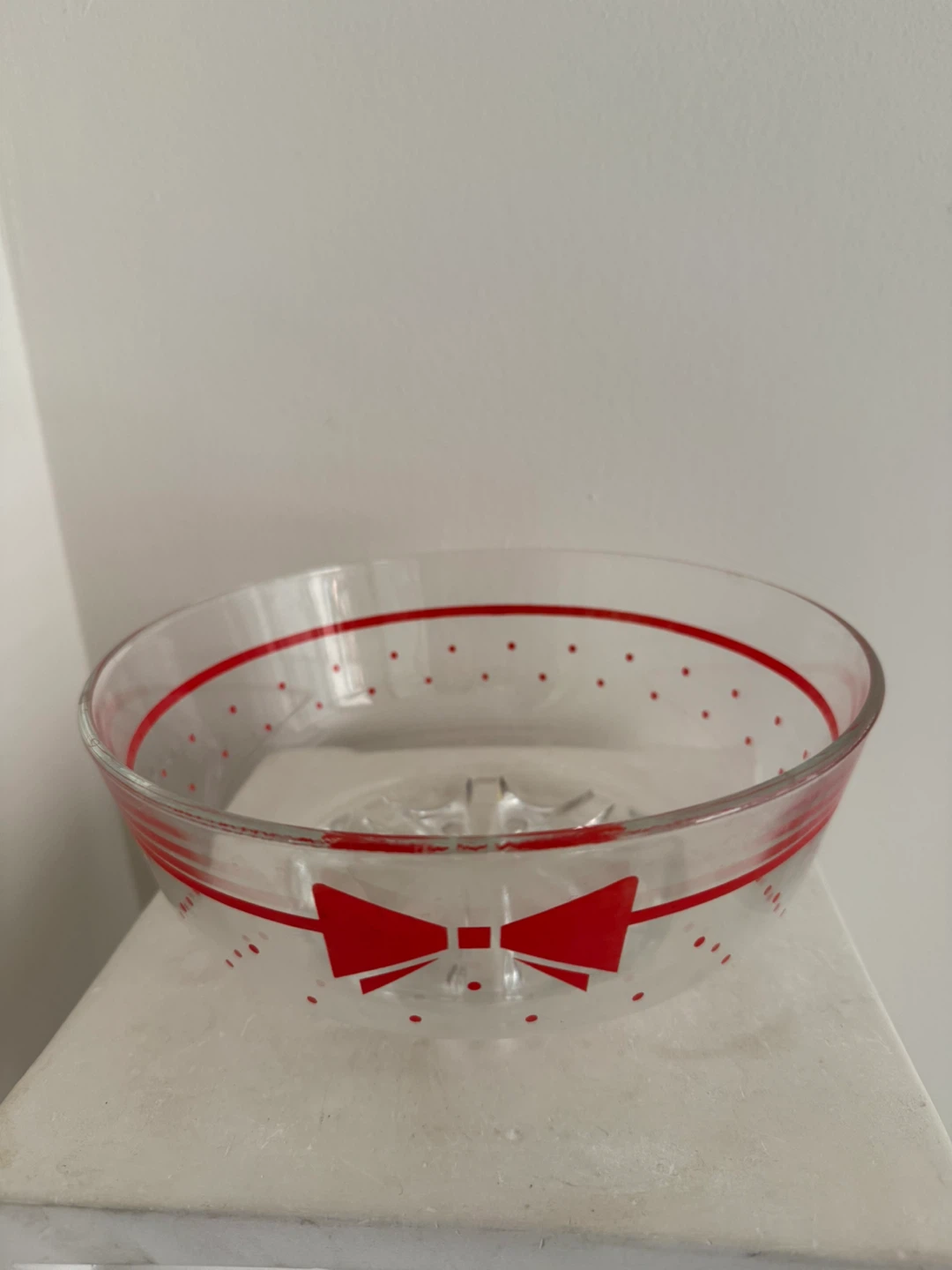 Glass bowl with red bow and polka dots