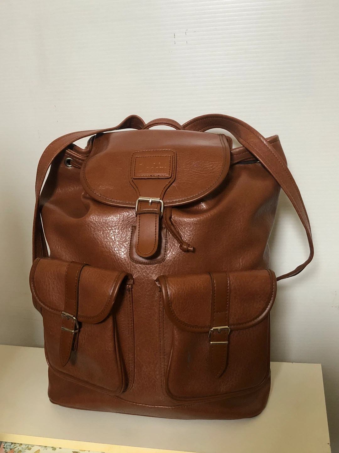 Women’s fashion back pack, leather look.  Brown in colour