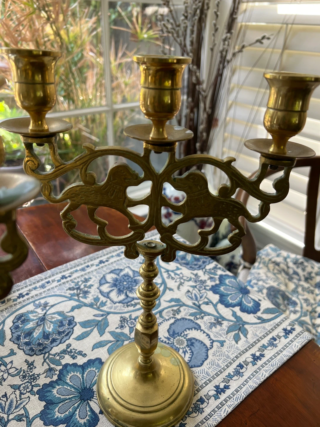A pair of Brass Candelabra with Lion Motif