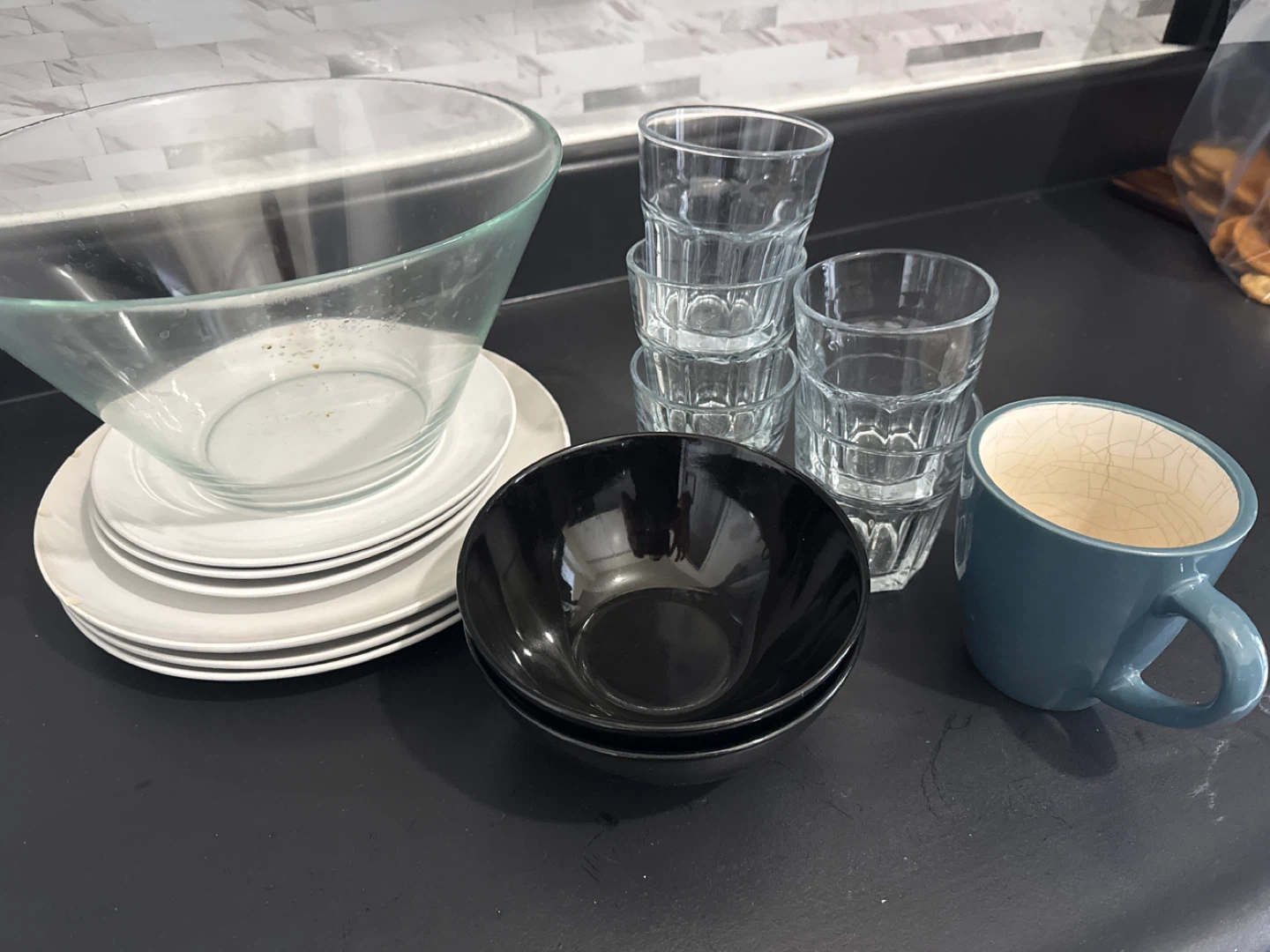 Assorted Kitchenware: Bowls, Plates, Glasses, and Mug