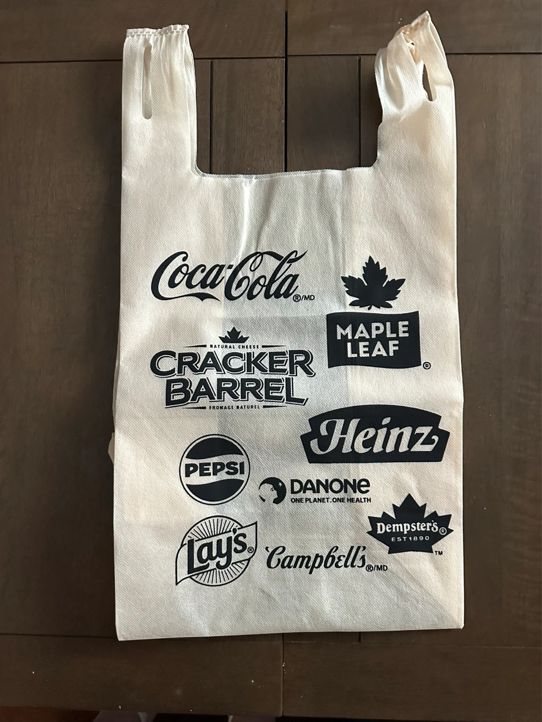 Reusable Longo’s shopping bag with various brand logos