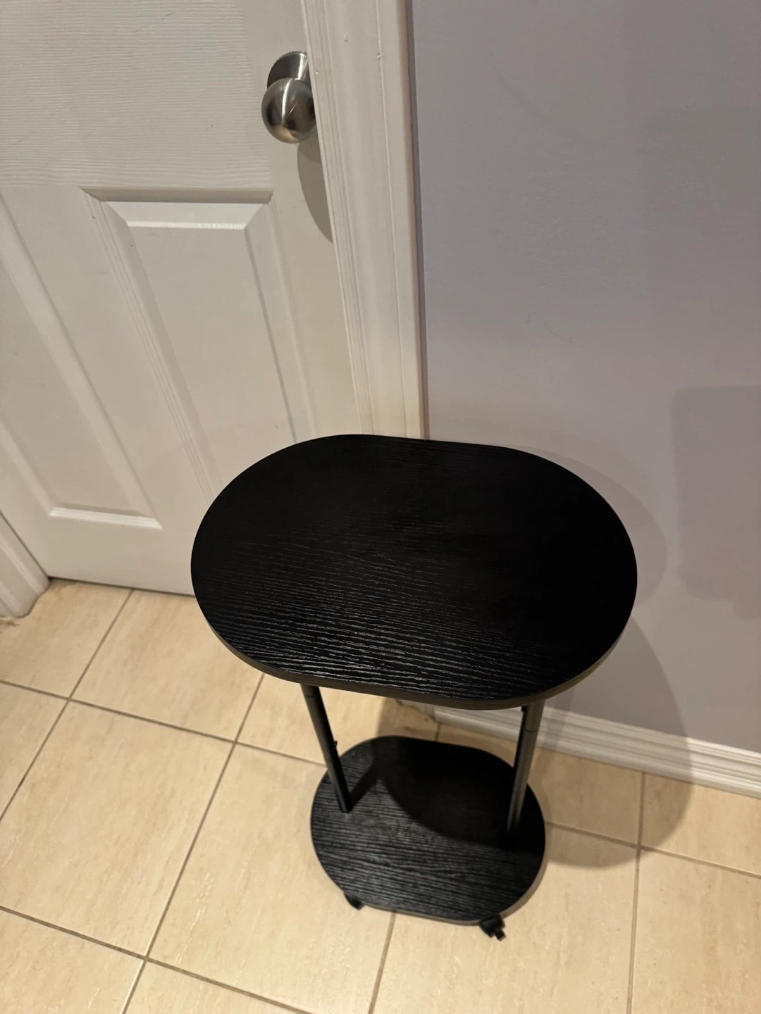 Black Oval Accent Table with Wheels - photo 3
