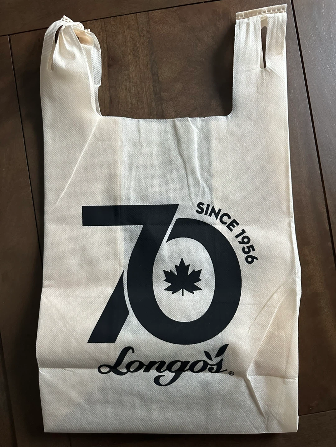 Reusable Longo’s shopping bag with various brand logos