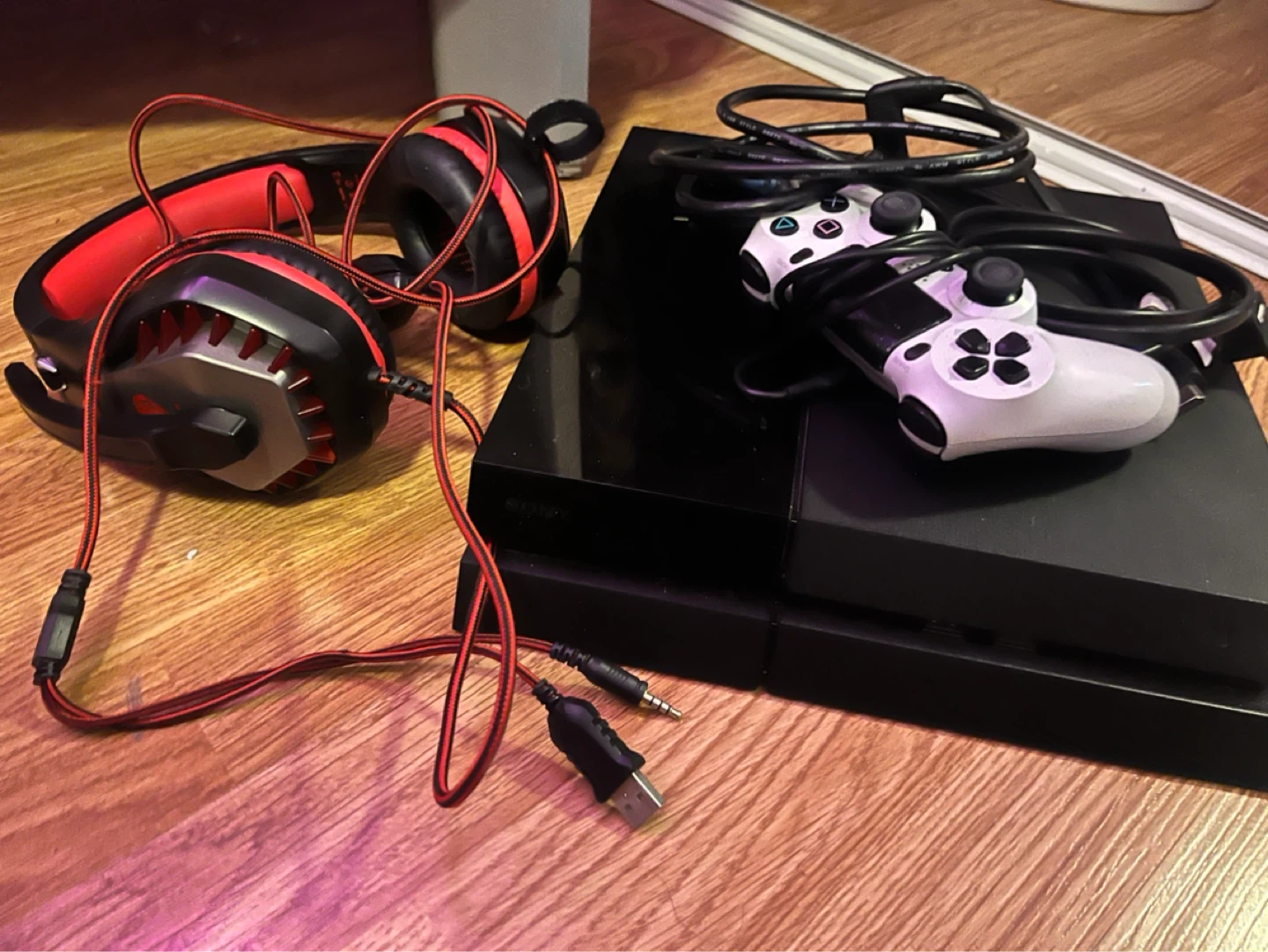 PlayStation 4 with one controller and gaming headset