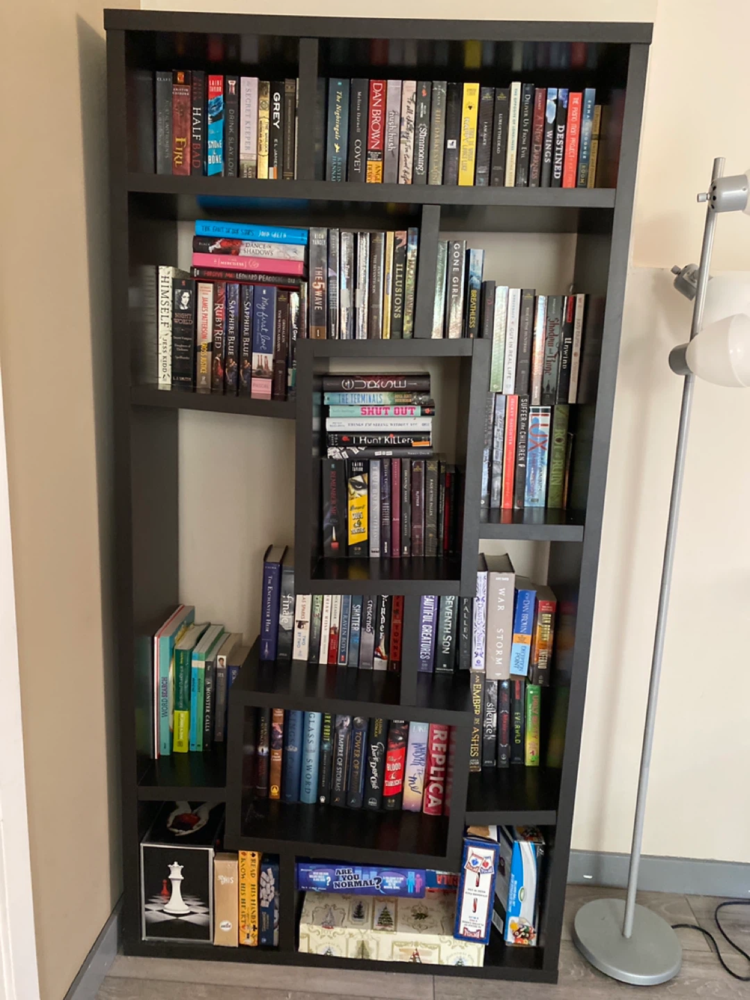 Dark Grey Bookshelf with Assorted Books