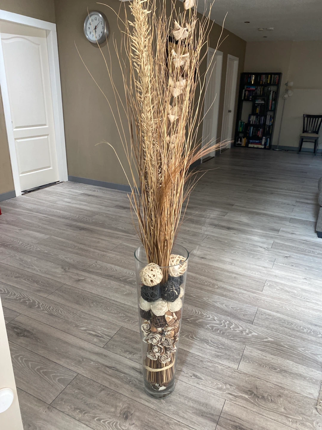 Tall Glass Vase with Dried Grass and Decorative Balls