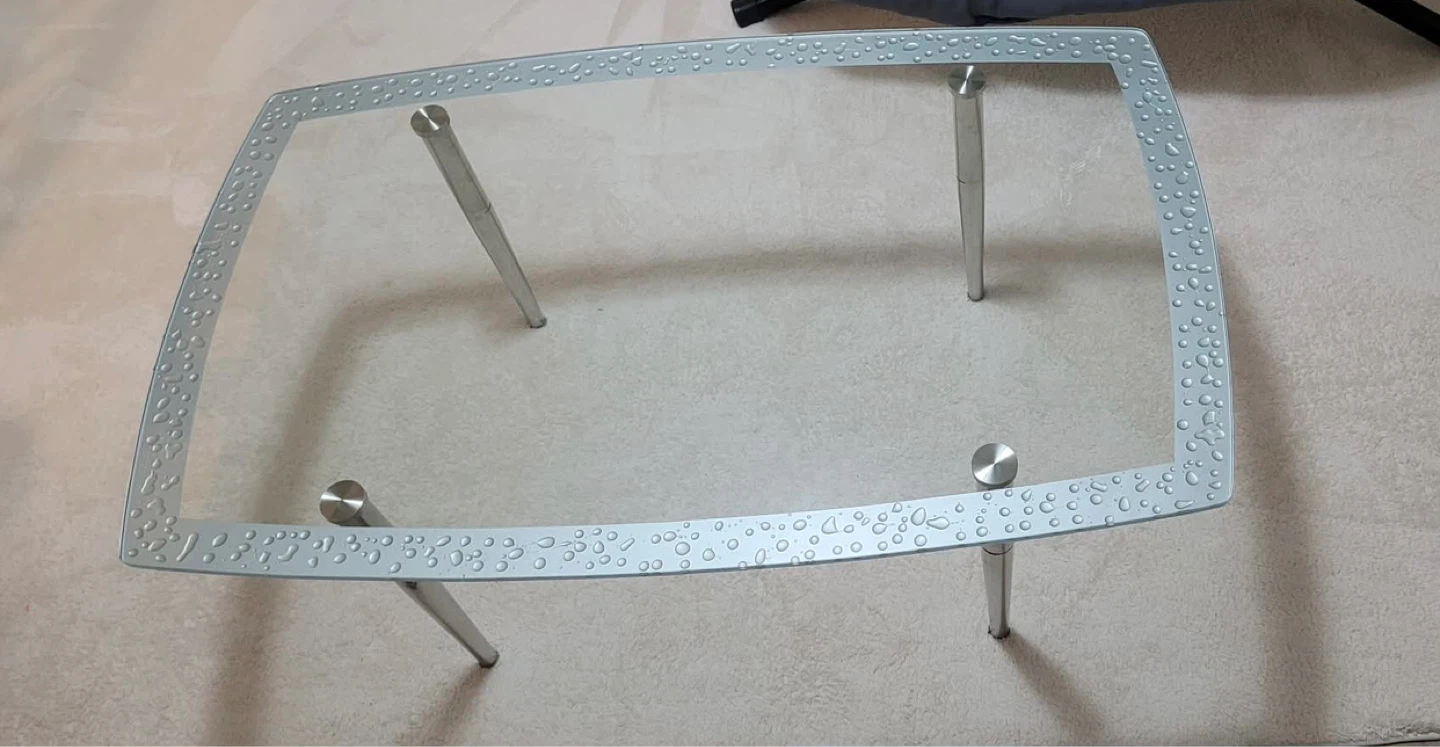 Glass coffee table with metal legs