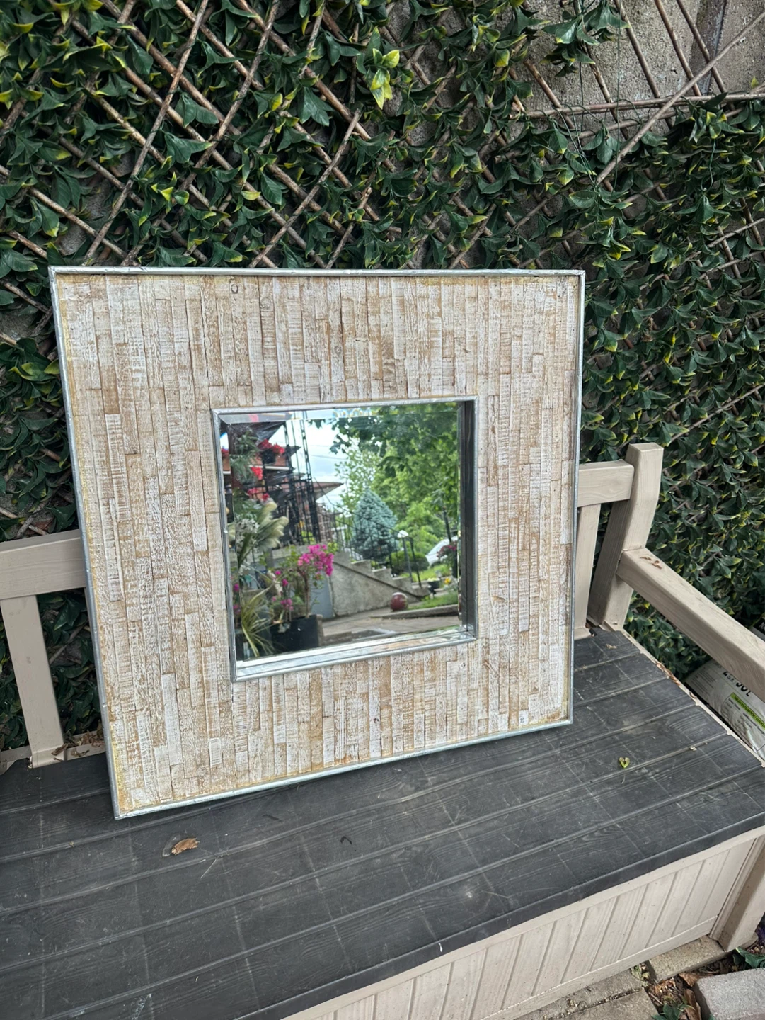 Decorative wall mirror with a stylish wide wooden frame